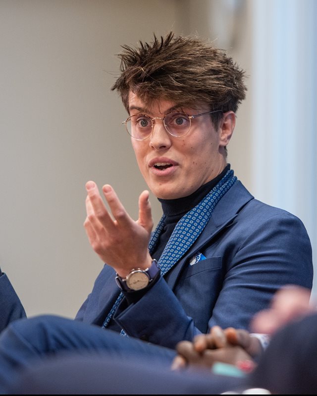 Oliver Harman speaking on a panel